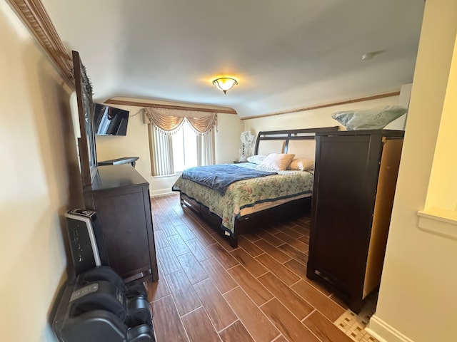 bedroom with ornamental molding