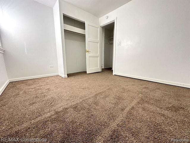 unfurnished bedroom with carpet