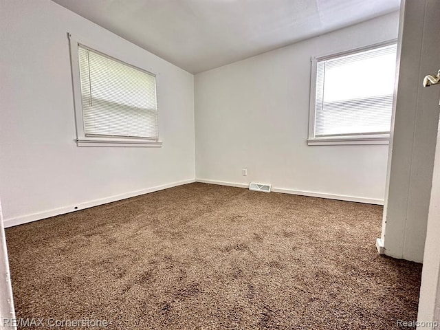 empty room featuring carpet flooring