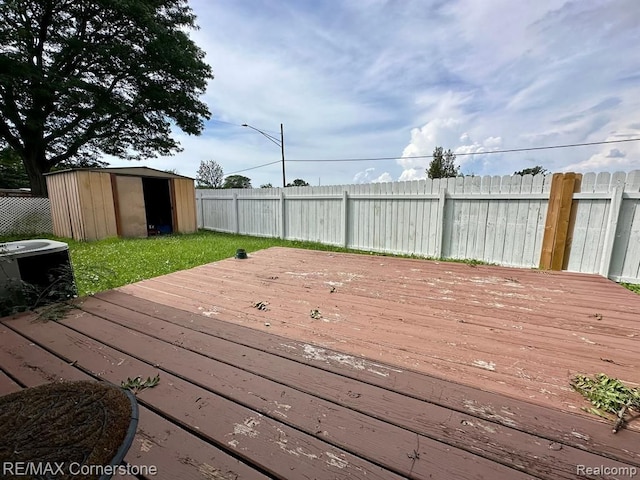 wooden terrace with a storage unit