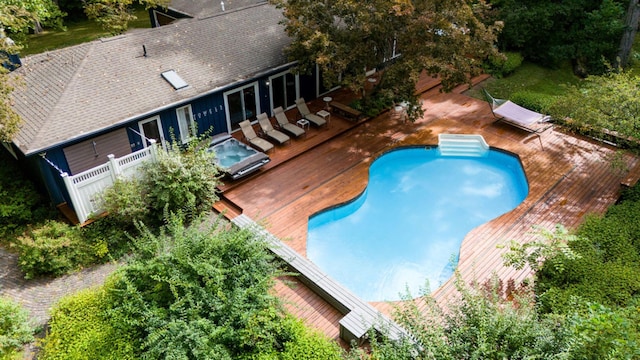 view of swimming pool with a deck