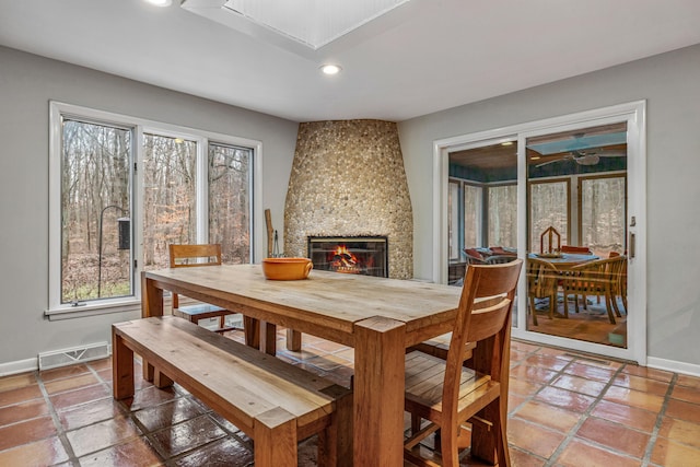 dining room featuring a large fireplace