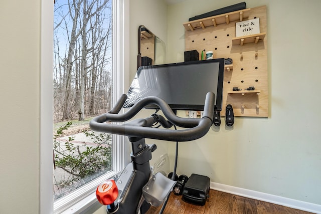 exercise area with dark hardwood / wood-style flooring