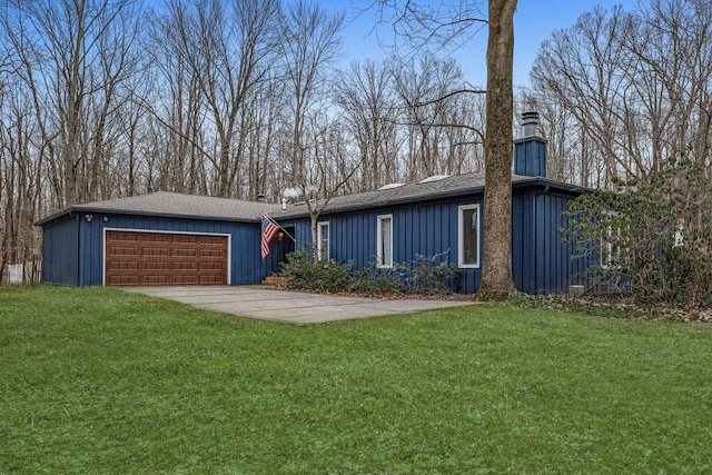 single story home featuring a front yard and a garage