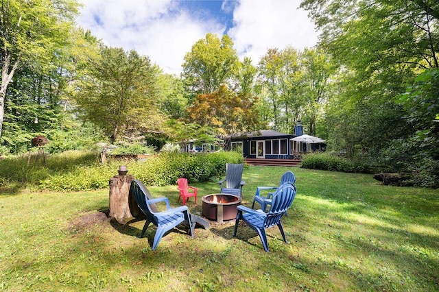 view of yard with an outdoor fire pit