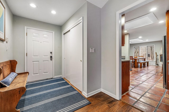 foyer entrance with dark wood-type flooring