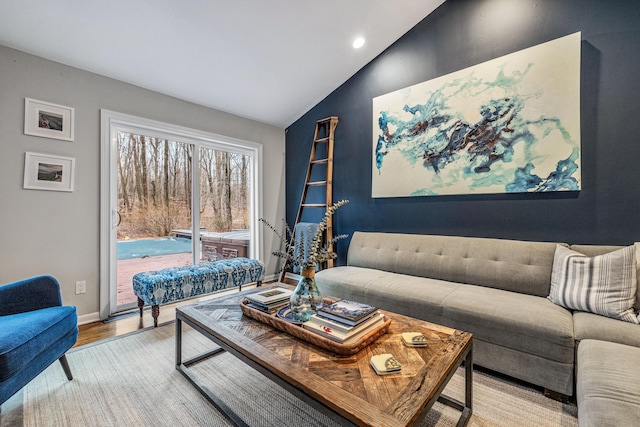 living room featuring hardwood / wood-style floors and vaulted ceiling