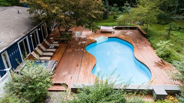 view of swimming pool featuring a deck