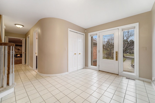 foyer entrance with light tile patterned flooring