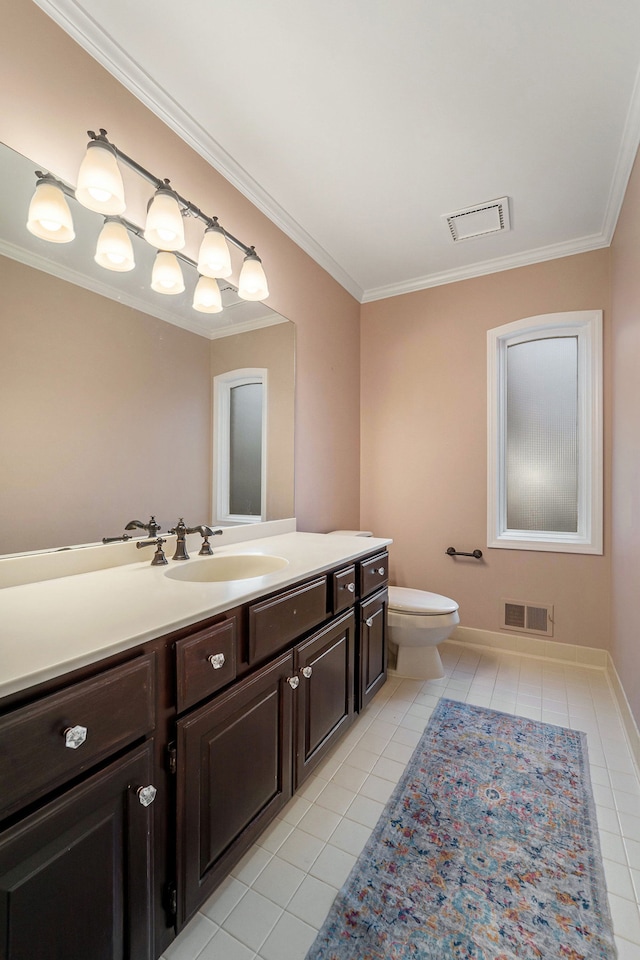 bathroom with tile patterned flooring, vanity, toilet, and crown molding