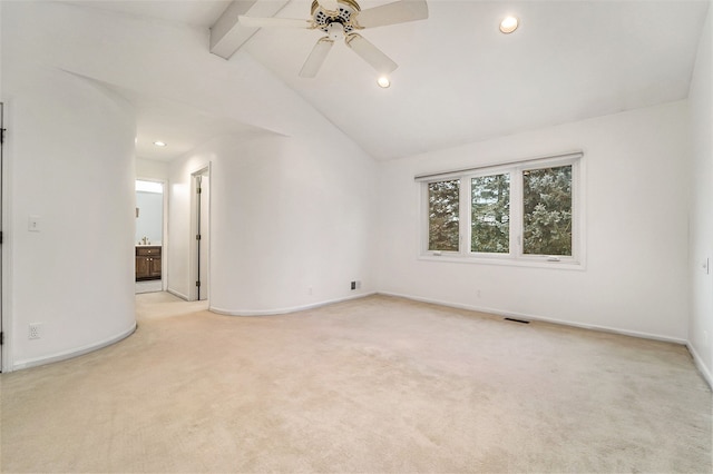 empty room featuring light carpet, vaulted ceiling with beams, and ceiling fan