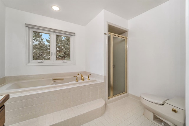 bathroom with tile patterned floors, a shower with door, vanity, and toilet