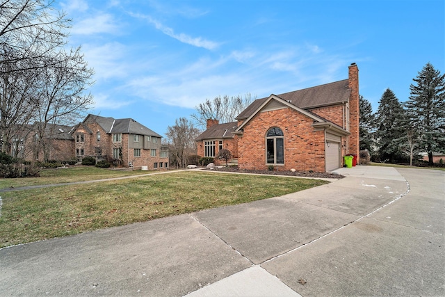 view of front of house featuring a front yard and a garage