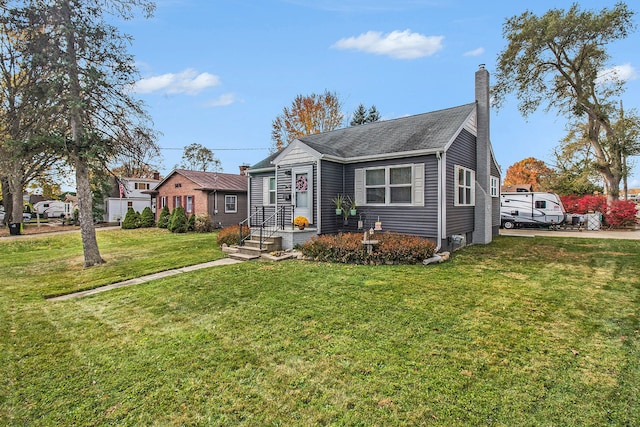 bungalow-style house featuring a front yard