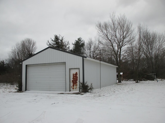 view of snow covered garage