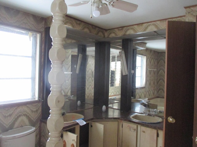 bathroom with vanity, toilet, and ceiling fan