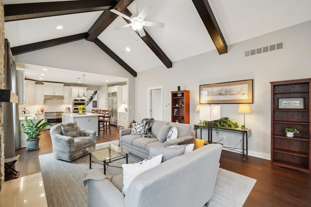 living room featuring beamed ceiling, dark hardwood / wood-style floors, high vaulted ceiling, and ceiling fan