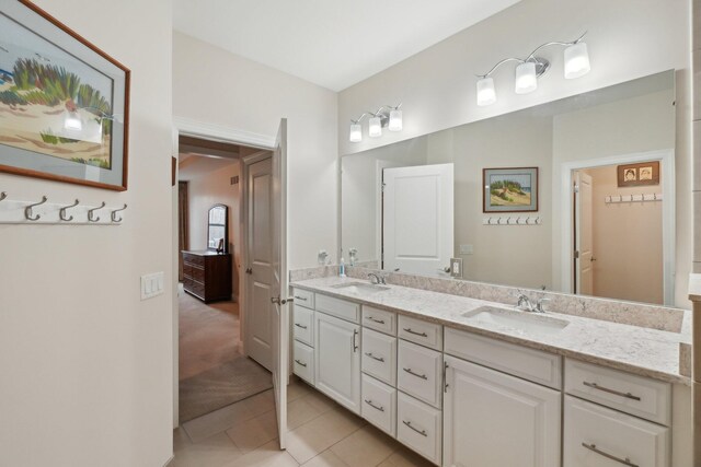 bathroom with tile patterned floors and vanity