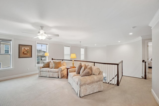 living room with light colored carpet, ceiling fan, and ornamental molding