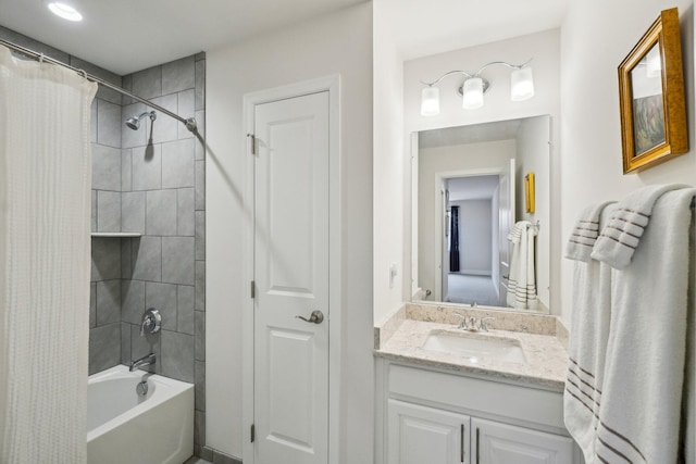 bathroom with shower / bath combination with curtain and vanity