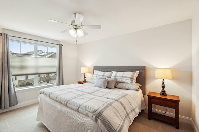 bedroom featuring ceiling fan and carpet