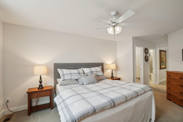 bedroom featuring ceiling fan and light carpet