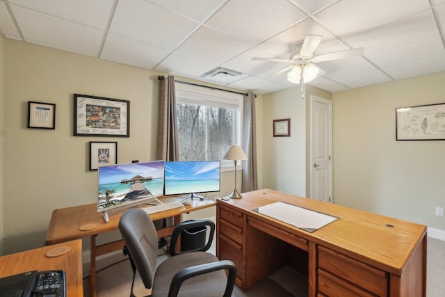 home office featuring a paneled ceiling and ceiling fan