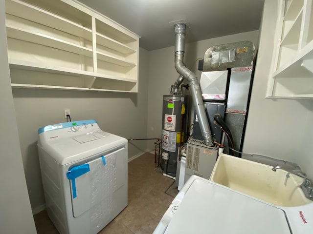 utilities featuring water heater and washer and dryer