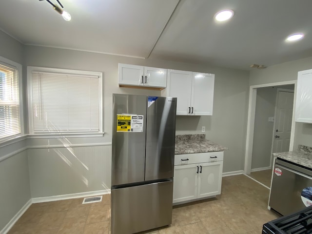 kitchen featuring white cabinets and stainless steel appliances