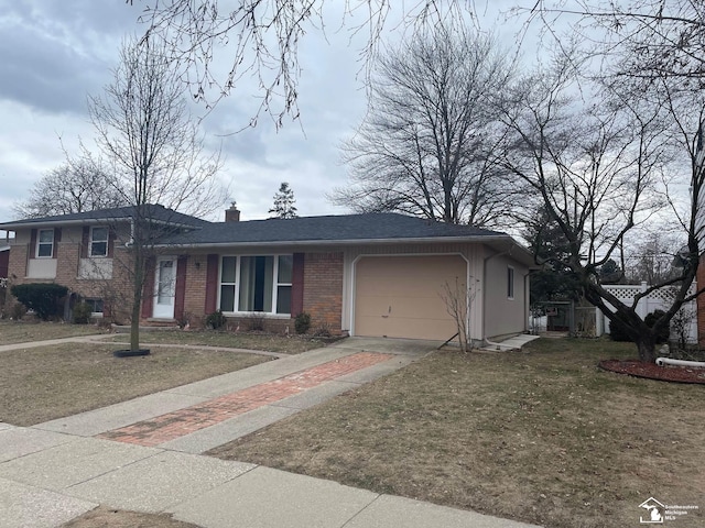 view of front facade with a front lawn and a garage