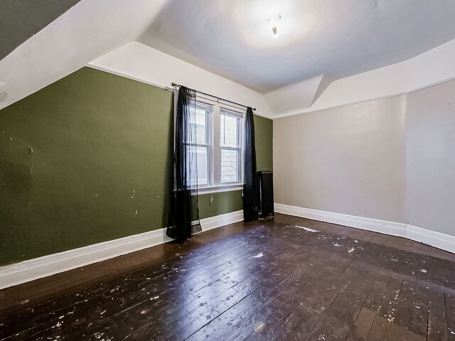 bonus room with lofted ceiling and wood-type flooring