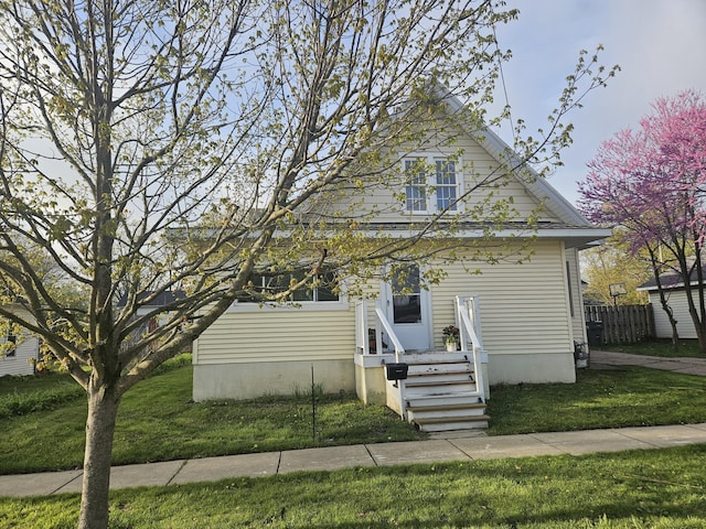 103 E Maple St, Three Oaks, MI 49128 - view of front of home featuring a front lawn