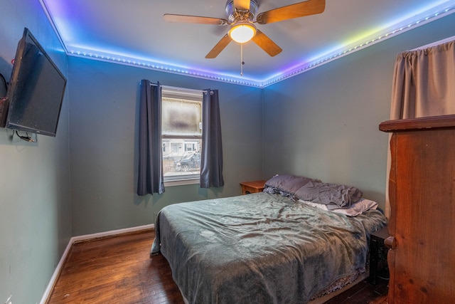 bedroom featuring ceiling fan and dark hardwood / wood-style flooring