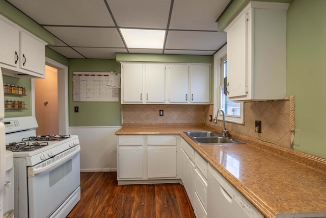 kitchen featuring sink, white appliances, white cabinetry, a paneled ceiling, and dark hardwood / wood-style flooring