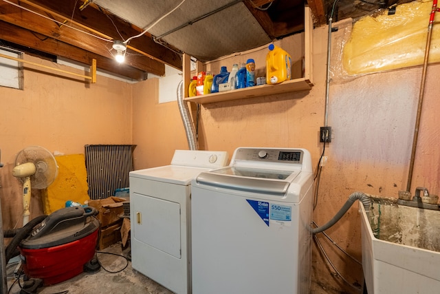 clothes washing area with washing machine and clothes dryer