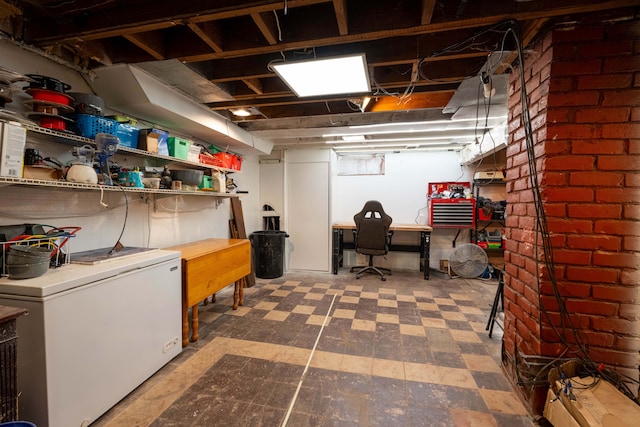 basement featuring refrigerator