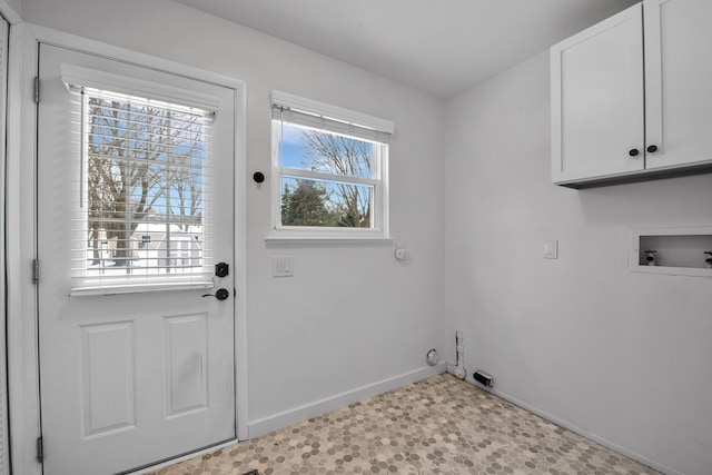 washroom with cabinets and washer hookup