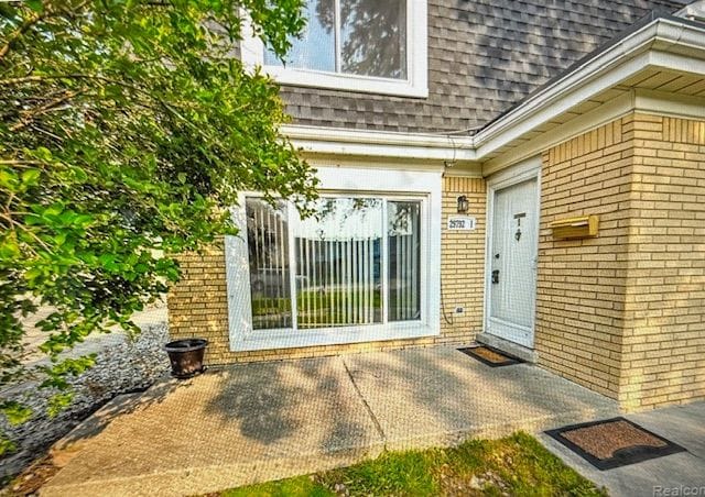 property entrance with a patio