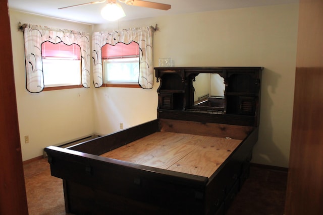 kitchen featuring ceiling fan and a baseboard heating unit