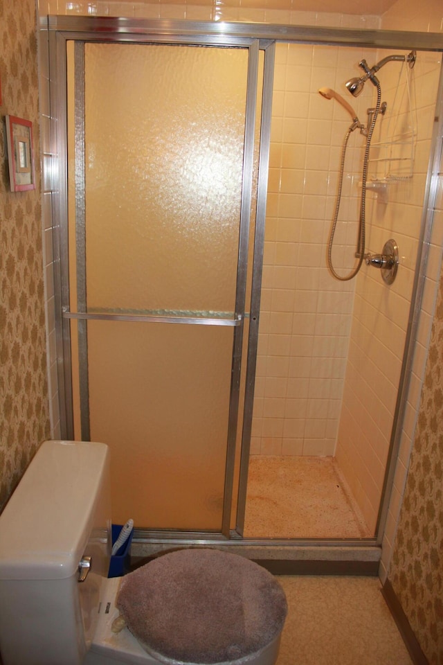 bathroom featuring a shower with shower door