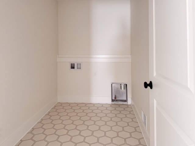 laundry area featuring light floors, laundry area, hookup for a washing machine, and visible vents