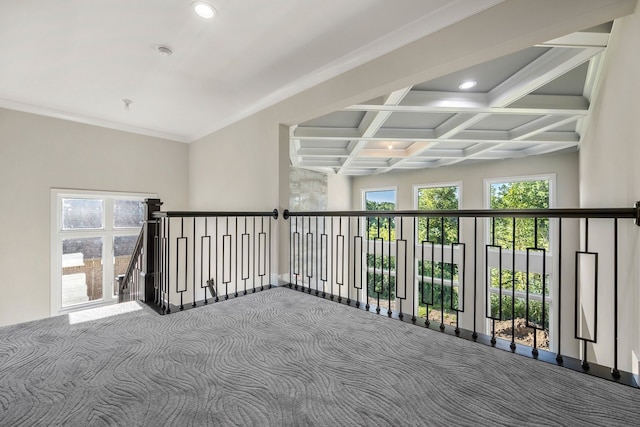 carpeted spare room featuring beamed ceiling, crown molding, and coffered ceiling