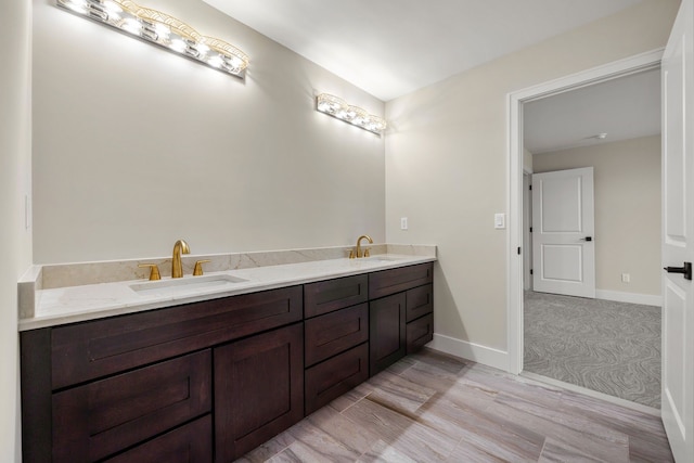 bathroom with vanity and hardwood / wood-style flooring