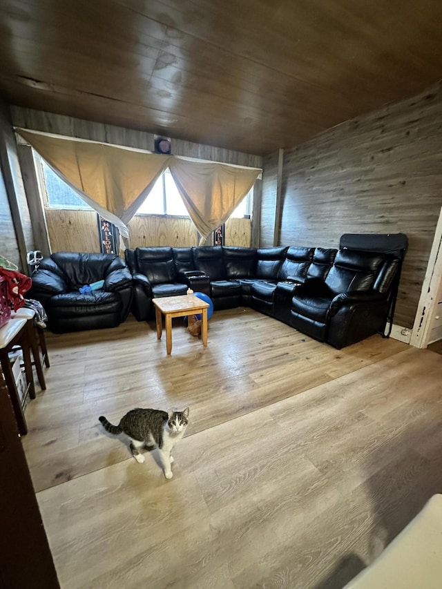 living room featuring hardwood / wood-style floors and wooden ceiling