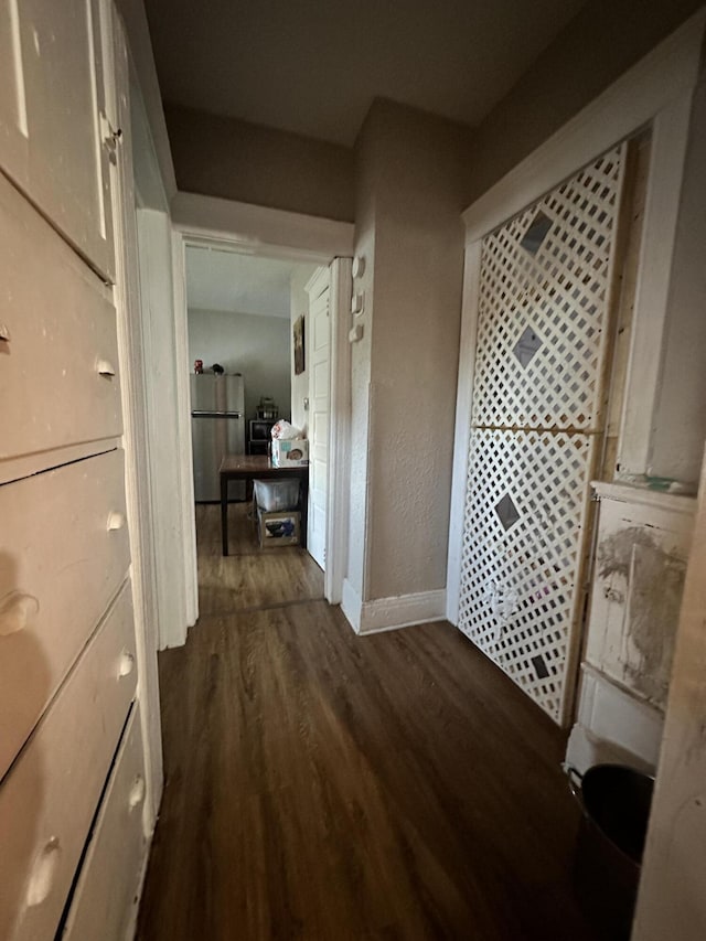 hall with dark hardwood / wood-style floors