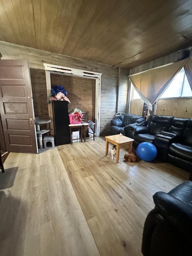 bonus room with hardwood / wood-style flooring, wood walls, and wooden ceiling