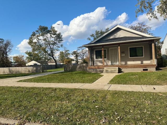 bungalow-style house with a porch and a front lawn