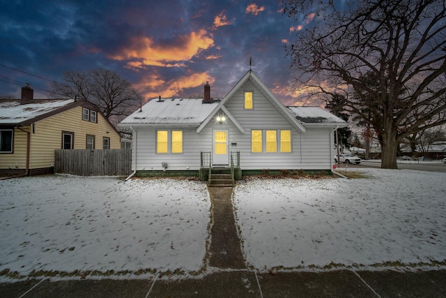 view of back house at dusk