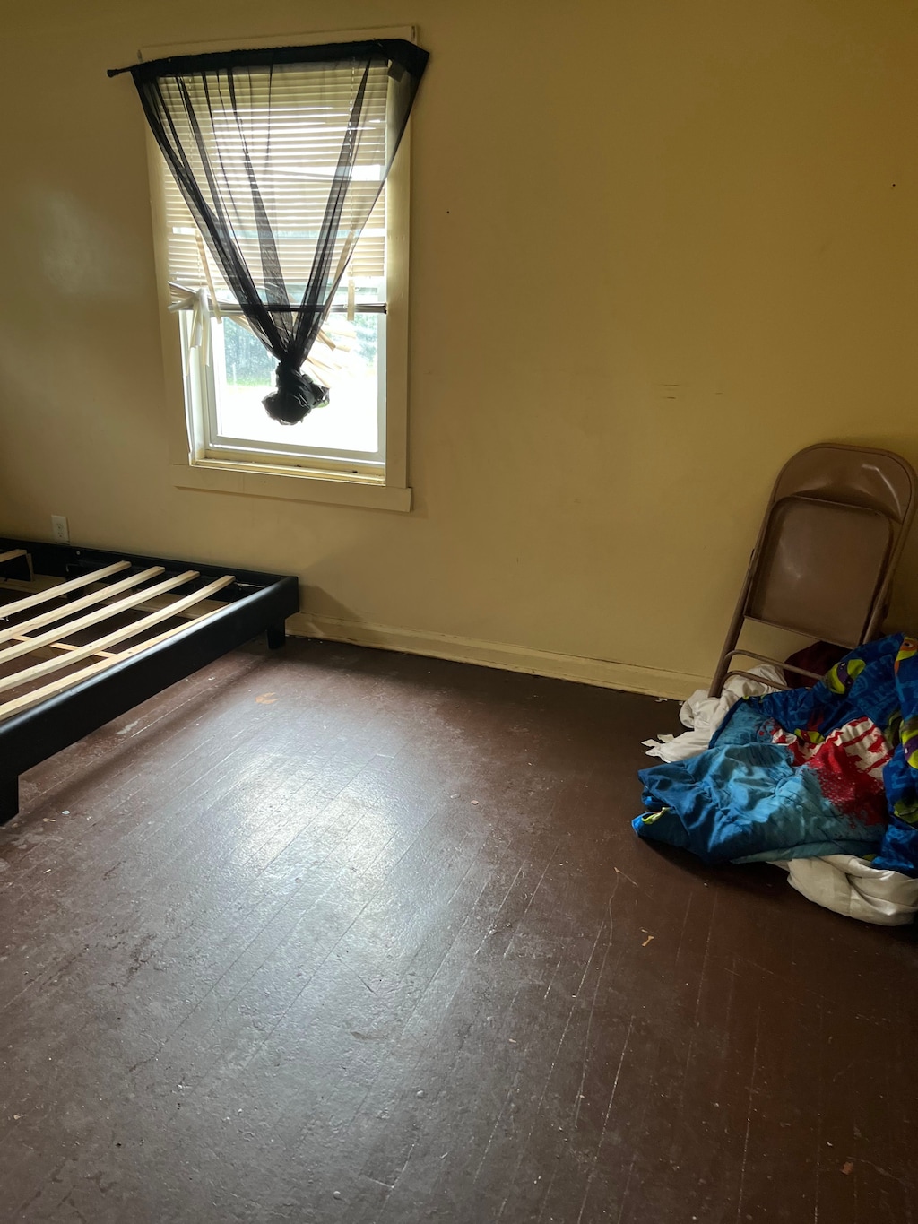 unfurnished bedroom featuring dark hardwood / wood-style flooring