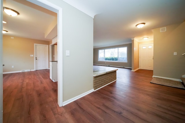 corridor featuring dark wood-type flooring